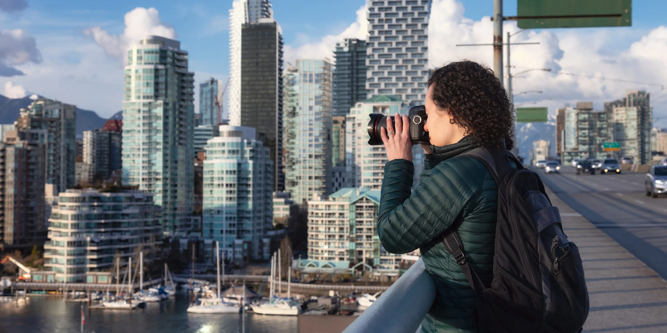 woman-with-camera-taking PHOTO OF MODERN CITY